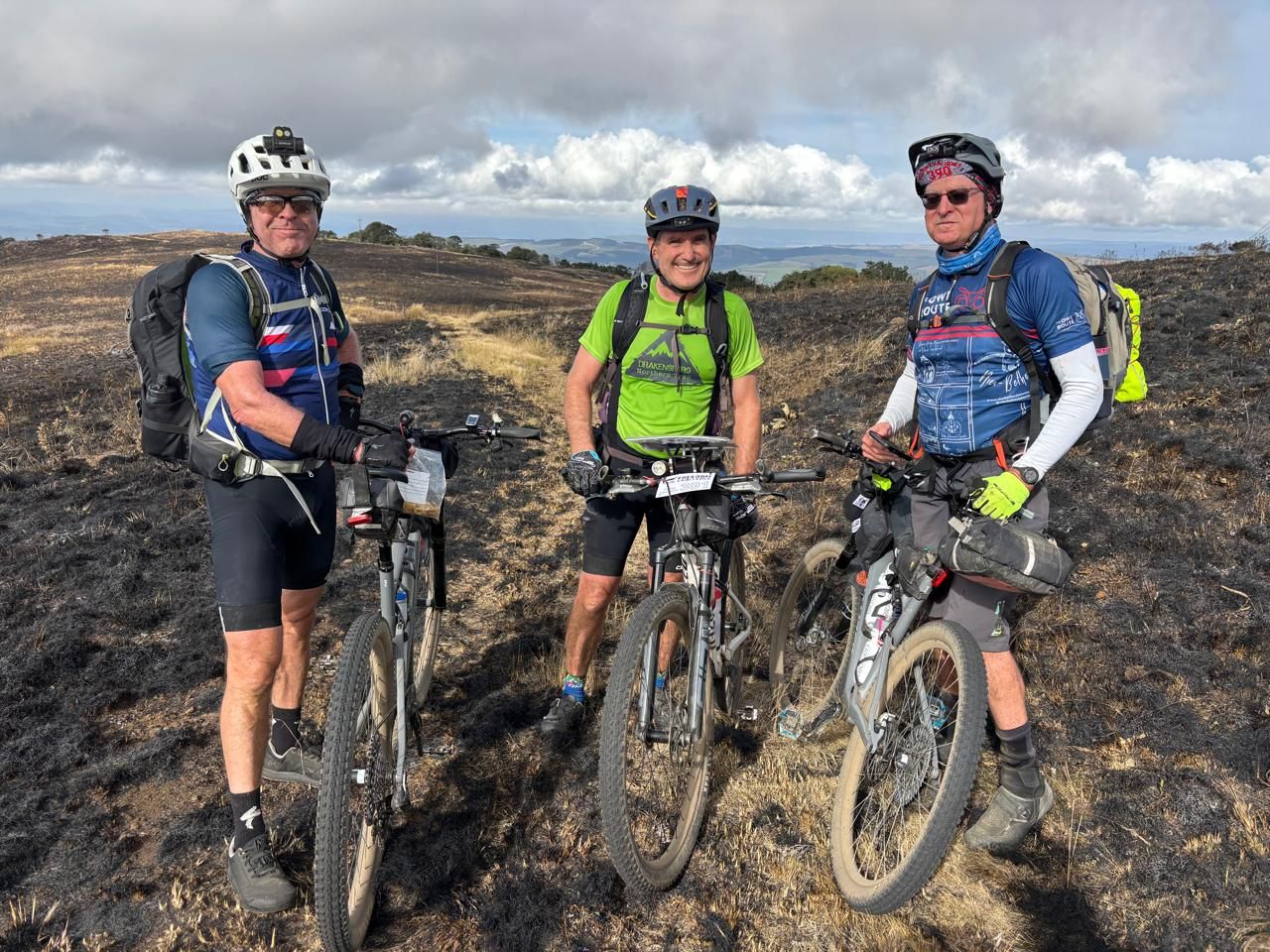 Three riders on a burnt ridge, Freedom Challenge 2026